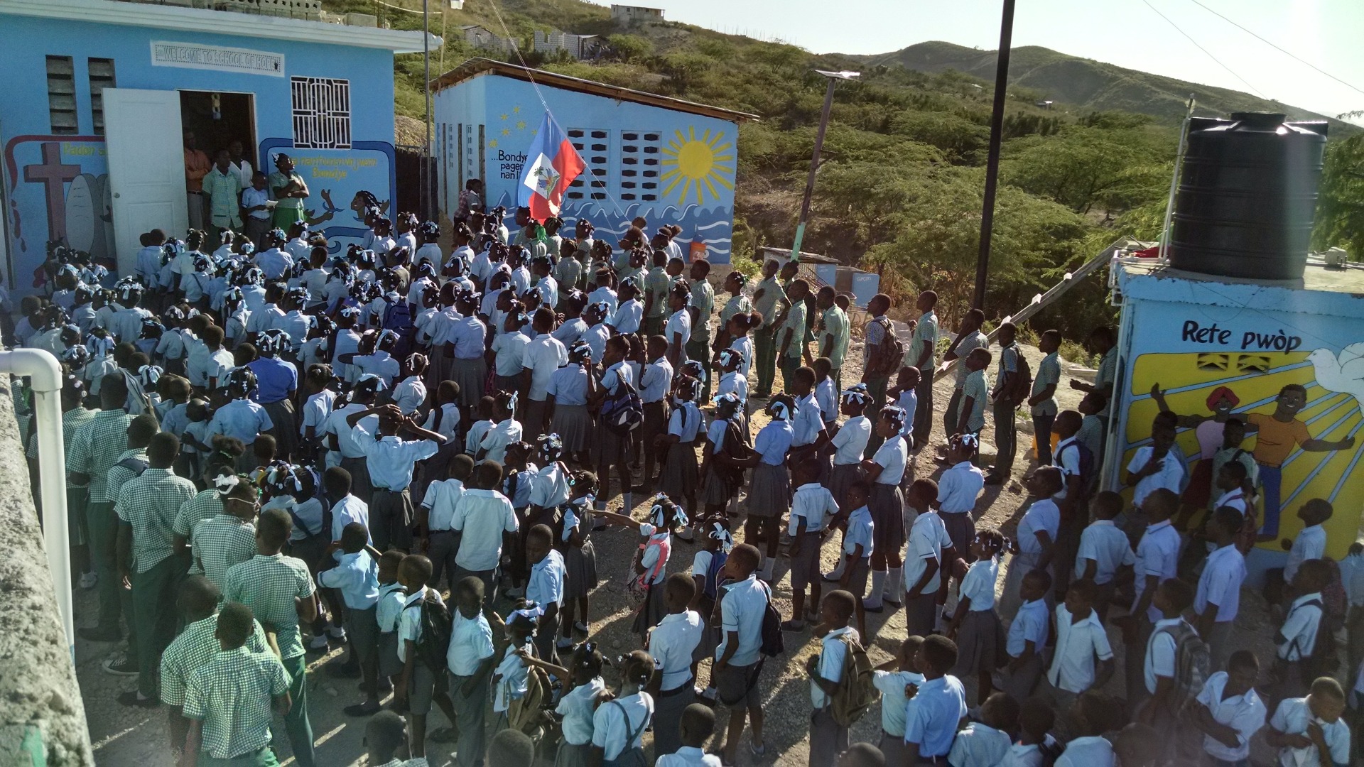 Children line up for roll call at School of Hope